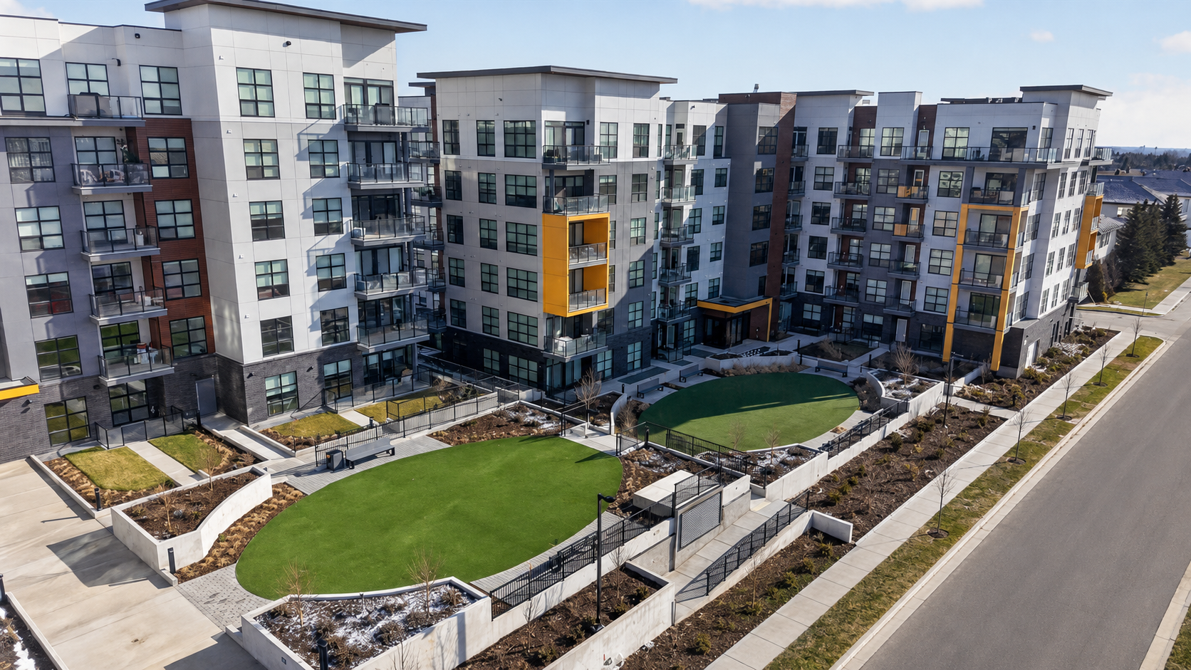 Modern condo building and courtyard in Currie Barracks